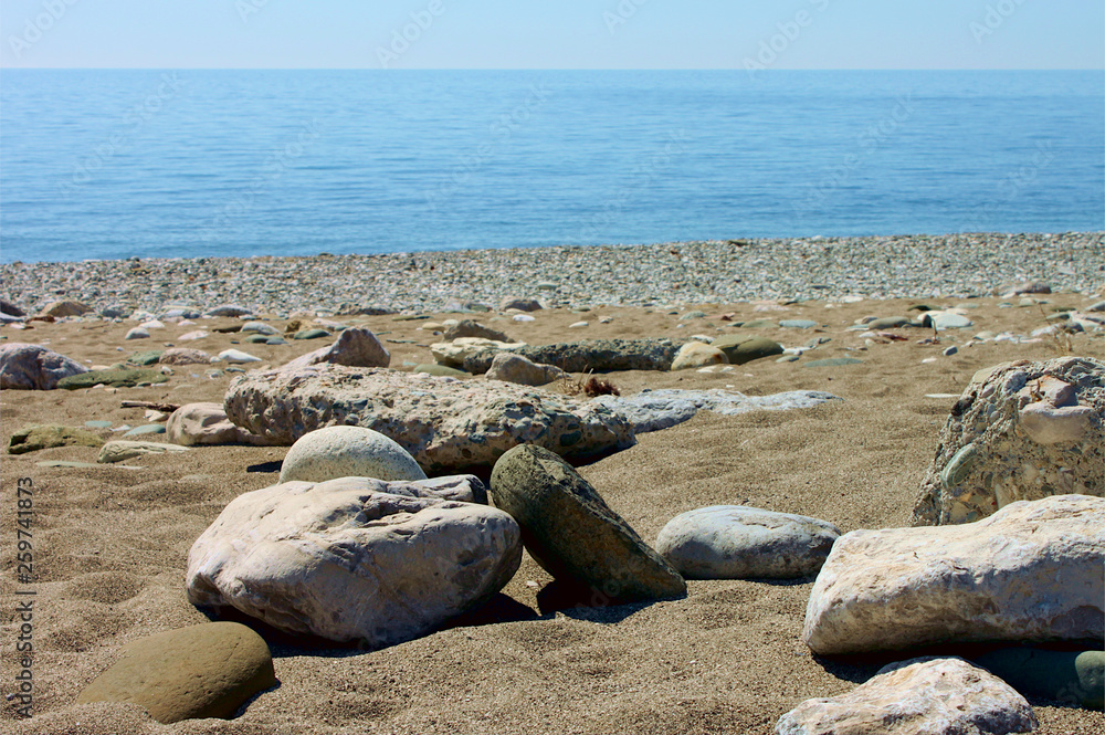 Stones on the beach against the sea. Gagra, Abkhazia