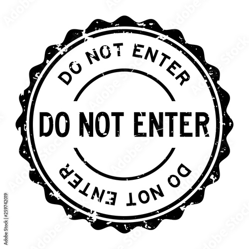 Grunge black do not enter word round rubber seal stamp on white background