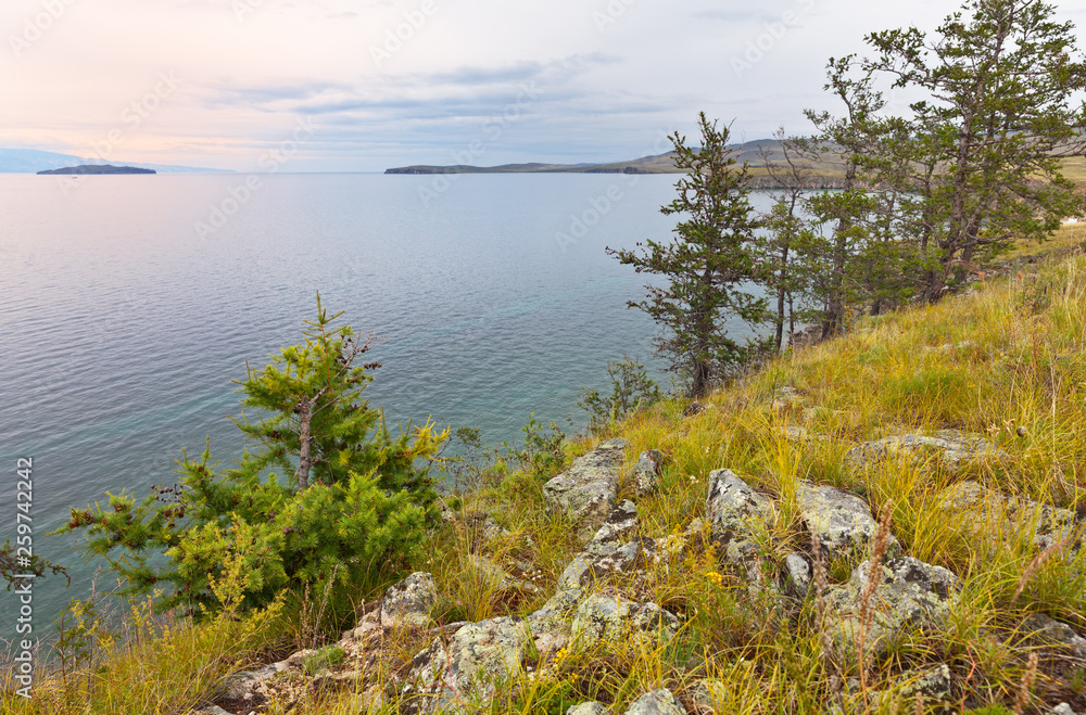 The shore of Lake Baikal in the summer. View from the shore of the island of Olkhon to the Small Sea Strait (Maloe More)