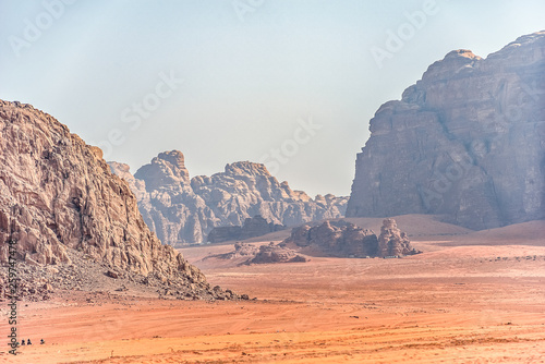 Fototapeta Naklejka Na Ścianę i Meble -  .incredible lunar landscape in Wadi Rum in the Jordanian red sand desert. Wadi Rum also known as The Valley of the Moon,  Jordan - Image