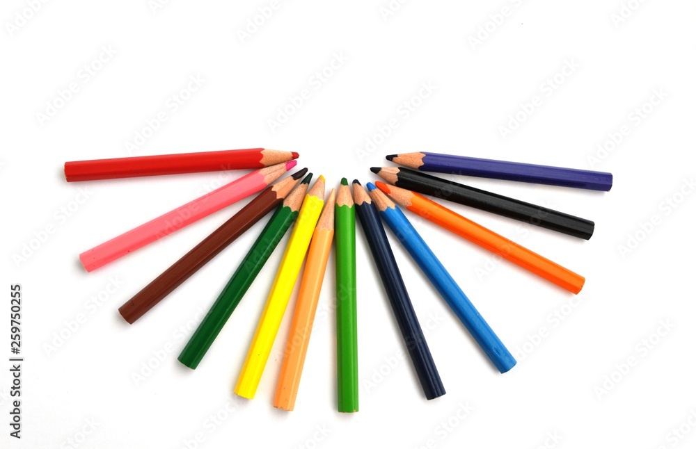 colored pencils in a set of twelve colors on a light background