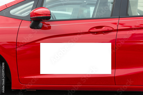 Blank White Megnetic Sign On Side Of Red Car