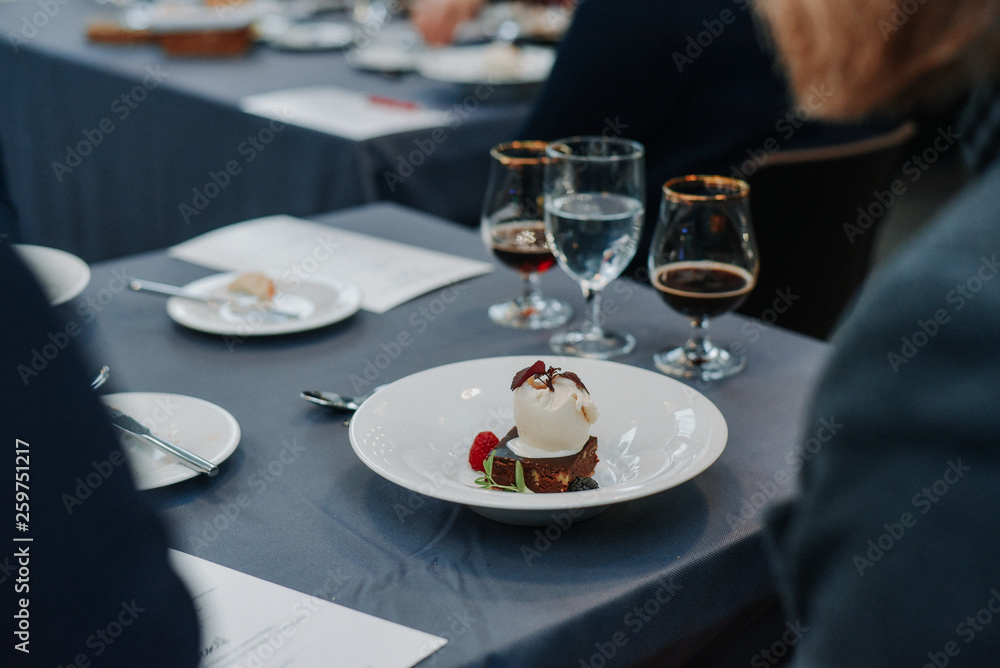Table setting at the restaurant with beer and desert Table setting at the restaurant with beer and desert