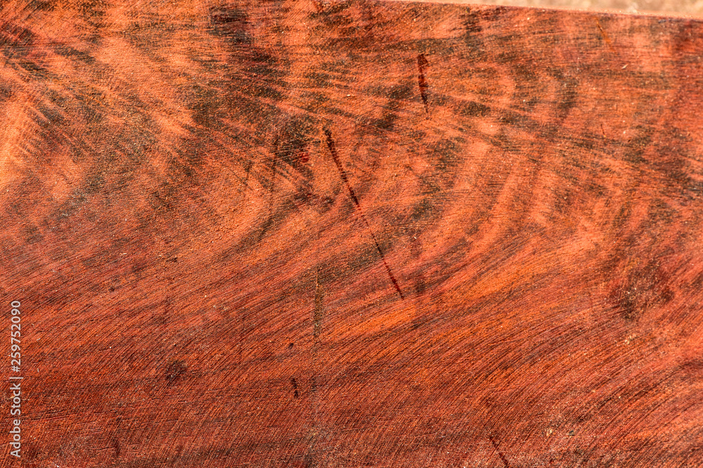 Naklejka premium The abstract natural slab wood texture of the background. The creative concept of ecological nature. Background mahogany pattern.