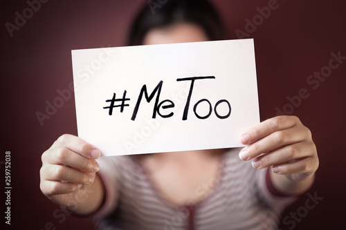 Young adult woman holding a sign with the hashtag MeToo photo