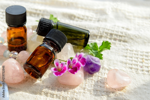 geranium oil and flower on crystals photo