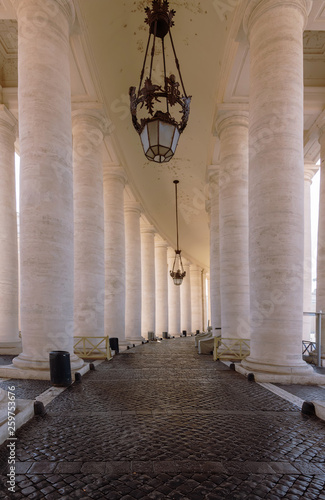 Passage between the columns in St. Peter's Square (san pietro plaza) in the Vatican. Roma (Rome).Italy