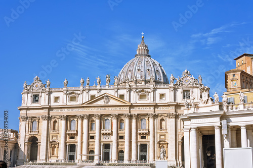 Fototapeta Naklejka Na Ścianę i Meble -  VATICAN CITY, VATICAN, Italy - March 2019: Fragments of the Papal Basilica of St. Peter (San Pietro Piazza) in the Vatican and columns on Saint Peter`s square in Rome