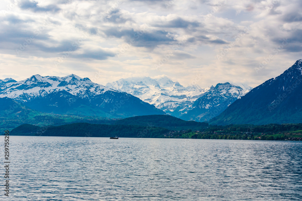 Travel ship in lake Thun and view of Bernese Alps mountain Berne, Switzerland