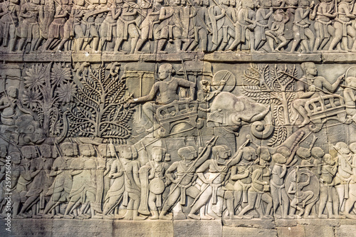 Carving on stone wall in Khmer temple at Angkor Wat in Cambodia 