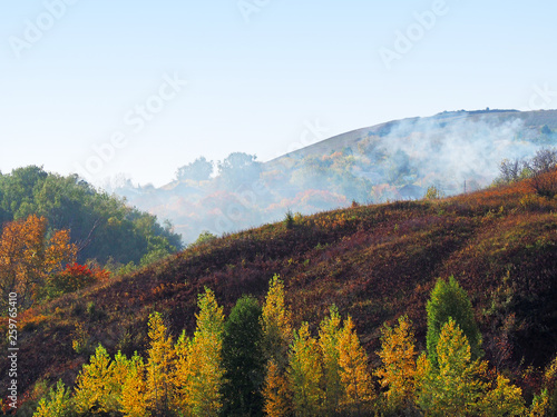 Forest fire, natural disaster, smoke on hills
