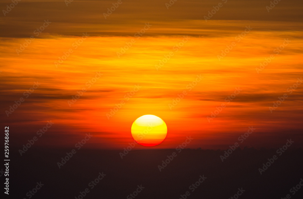 The sun is going to be the secret of the horizon in the dark cludy sky. The sun is going to be the secret of the horizon in the dark cludy sky.