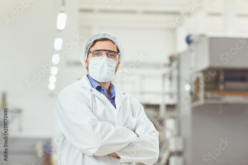 Chemist man in mask at work