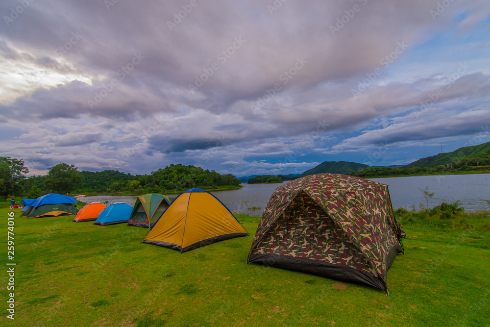 Tent spots along the reservoir in the middle of the forest Resting place with cloudy sky  in Thailand