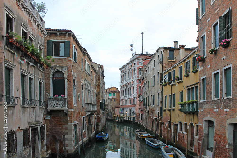 Narrow water channel in Venice Italy