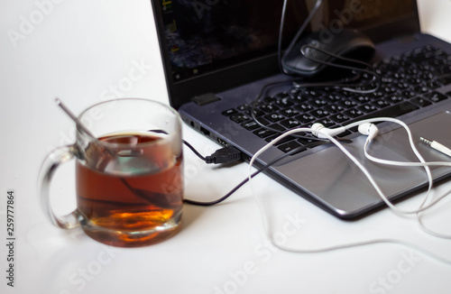 a cup of tea and a laptop