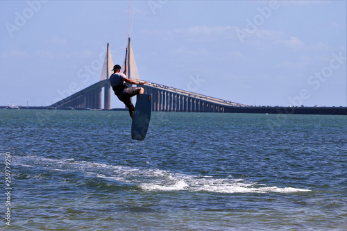 Εκτύπωση καμβά Kite surfer gaining air with a kite above as he attempts to jump the skyway brid
