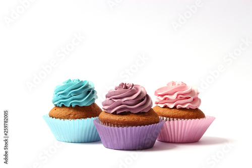  tasty cupcakes on a white background.