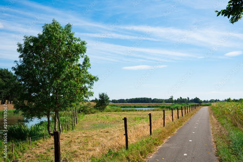 landscape with road in fortified city Heusden, The Netherlands. Blue sky, space for text