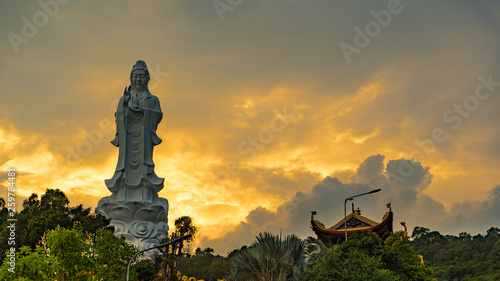Ho quoc pagoda in phu Quoc island. Monument of Lady buddha in a beautiful sunset in Vietnam