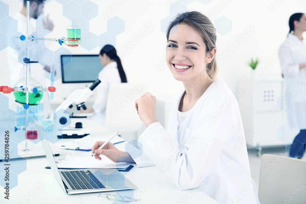 Medical student working with laptop in modern laboratory Medical student working with laptop in modern laboratory