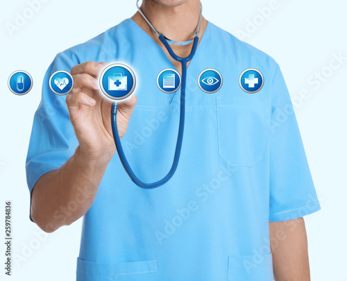 Doctor with stethoscope and informational icons on light background, closeup. Medical service