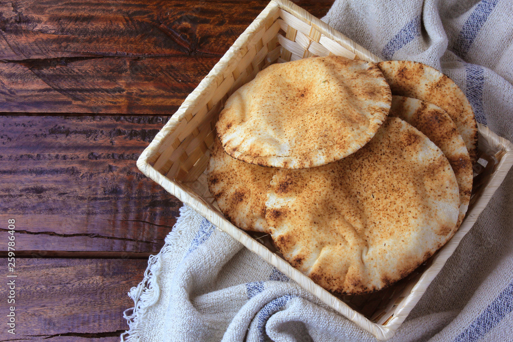Pita bread isolated on white background in the breakfast basket, on