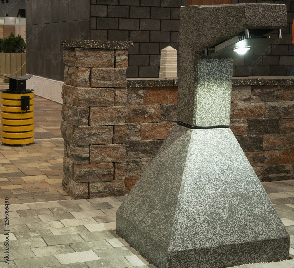 Obraz premium close-up modern solid concrete street lantern at city park