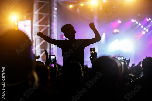 The man in the cap gets pleasure from the concert photo