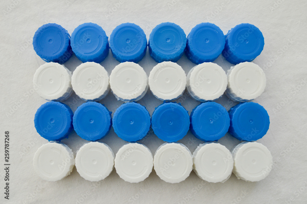 plastic plugs in blue and white interleaved in four rows plastic plugs in blue and white interleaved in four rows