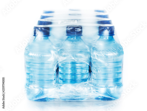 packed plastic bottles of water isolated