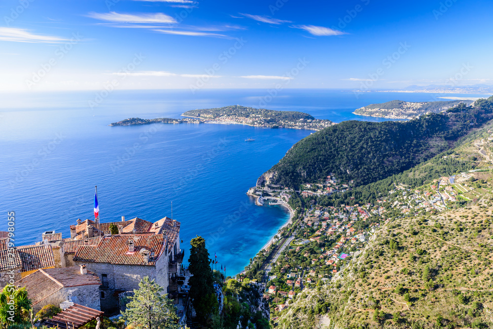 Scenic view of the Mediterranean coastline and medieval houses from the top of the town of Eze village on the French Riviera