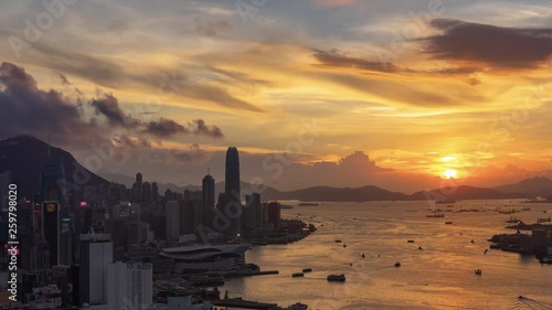 Time lapse of Victoria harbour and Hong Kong city at sunset photo