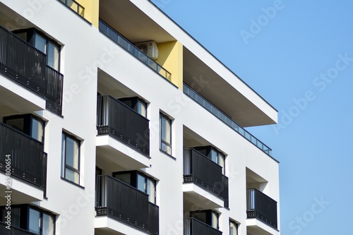 European modern residential architecture. Fragment of a modern apartment building in front. Very modern apartment house. 