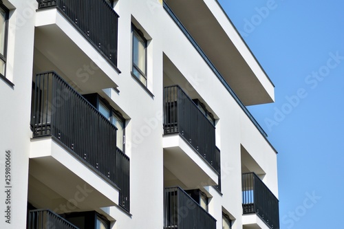 European modern residential architecture. Fragment of a modern apartment building in front. Very modern apartment house. 