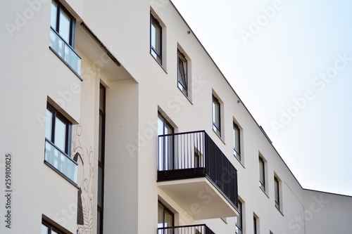 European modern residential architecture. Fragment of a modern apartment building in front. Very modern apartment house.  © Grand Warszawski