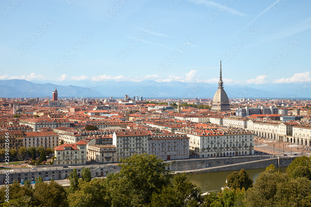 Turin skyline view, Mole Antonelliana tower and Po river in a sunny summer day in Italy