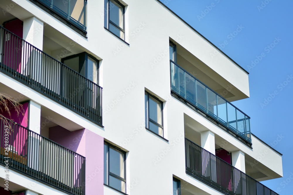 European modern residential architecture. Fragment of a modern apartment building in front. Very modern apartment house. 