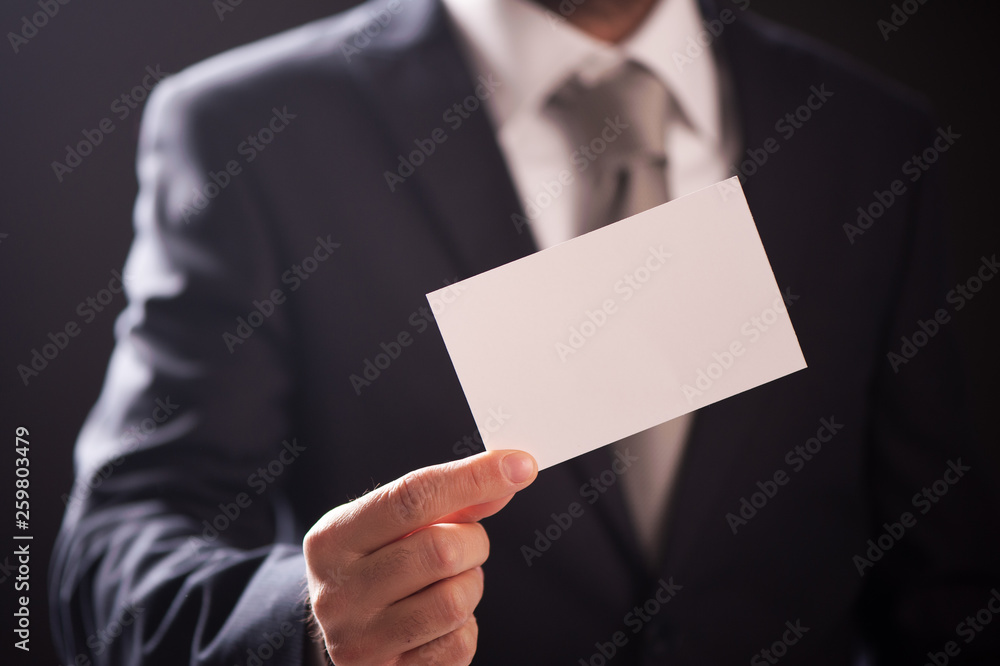 Businessman showing his visiting card Businessman showing his visiting card