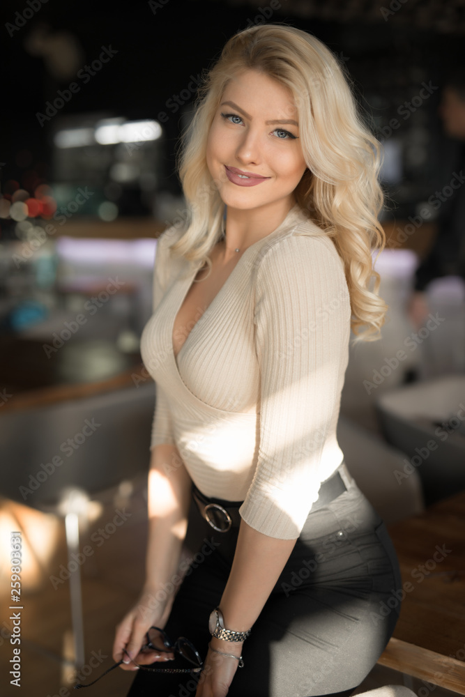 Sexy beautiful woman posing in cafe like model Sexy beautiful woman posing in cafe like model