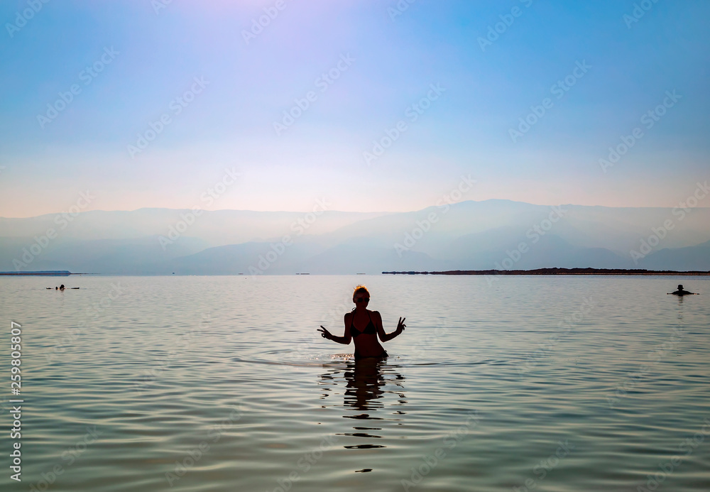 Girl bathing in Dead sea