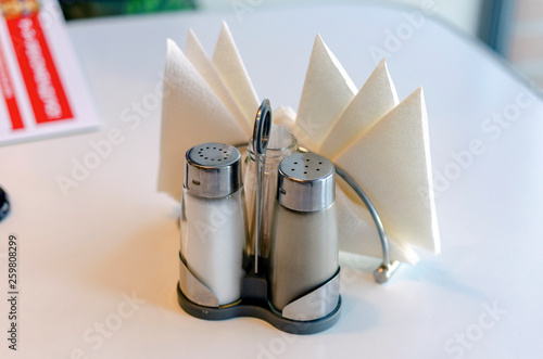 Salt and pepper shakers on wooden table