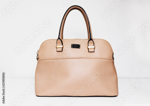 Elegant fashionable formal beige leather handbag for business woman on white background, trendy minimalistic luxury style