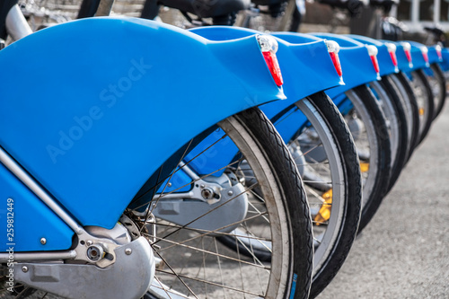 Blue rental Bicycles in a row