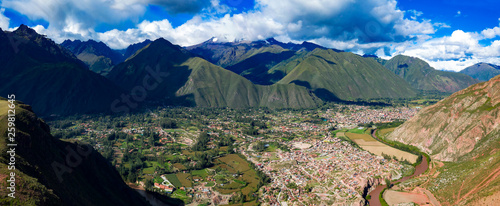 Aerial panoramic view of Urubamba city and river located at the Sacred Valley of the Incas near Cusco city. Mountains alpine landscape in a region of Cusco, Peru.
