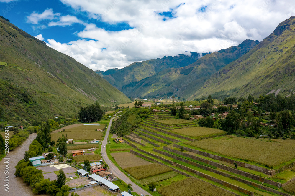 Aerial view of Inca agriculture terraces at the Sacred Valley of the Incas near Urubamba town. Mountains alpine landscape in a region of Cusco, Peru.