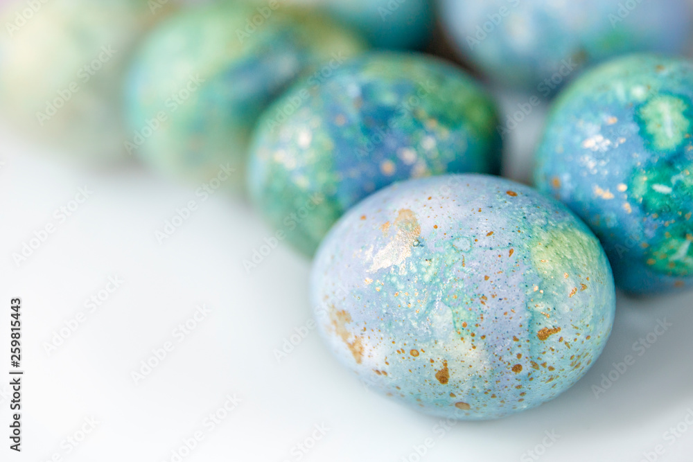Easter painted eggs . Blue-green shades on white background. The theme of the Easter holiday. Easter painted eggs . Blue-green shades on white background. The theme of the Easter holiday.