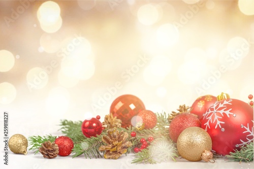 Christmas decorations with tree branches and baubles isolated on white background