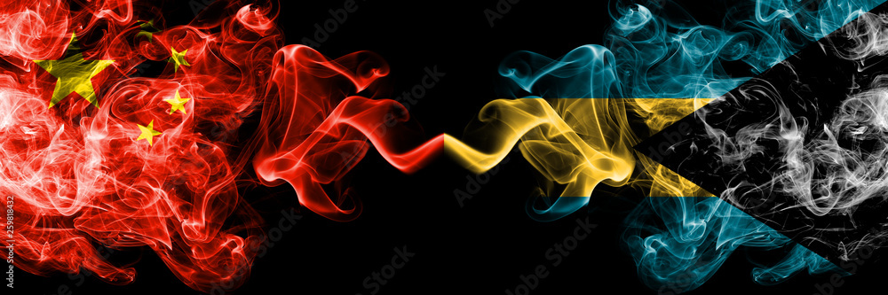 China vs Bahamas, Bahamian smoke flags placed side by side. Thick colored silky smoke flags of Chinese and Bahamas, Bahamian China vs Bahamas, Bahamian smoke flags placed side by side. Thick colored silky smoke flags of Chinese and Bahamas, Bahamian