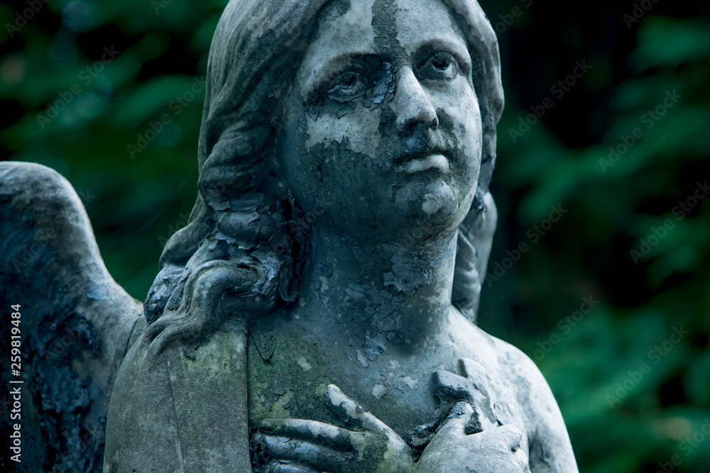 Sad angel. Antique statue. Religion, Christianity, faith, immortality, concept.